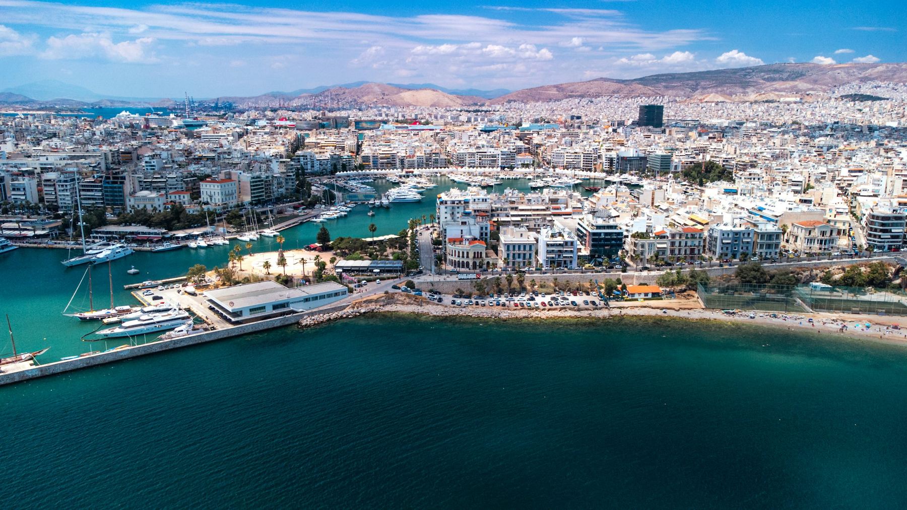 Aerial view of a marina and apartment buildings in Piraeus